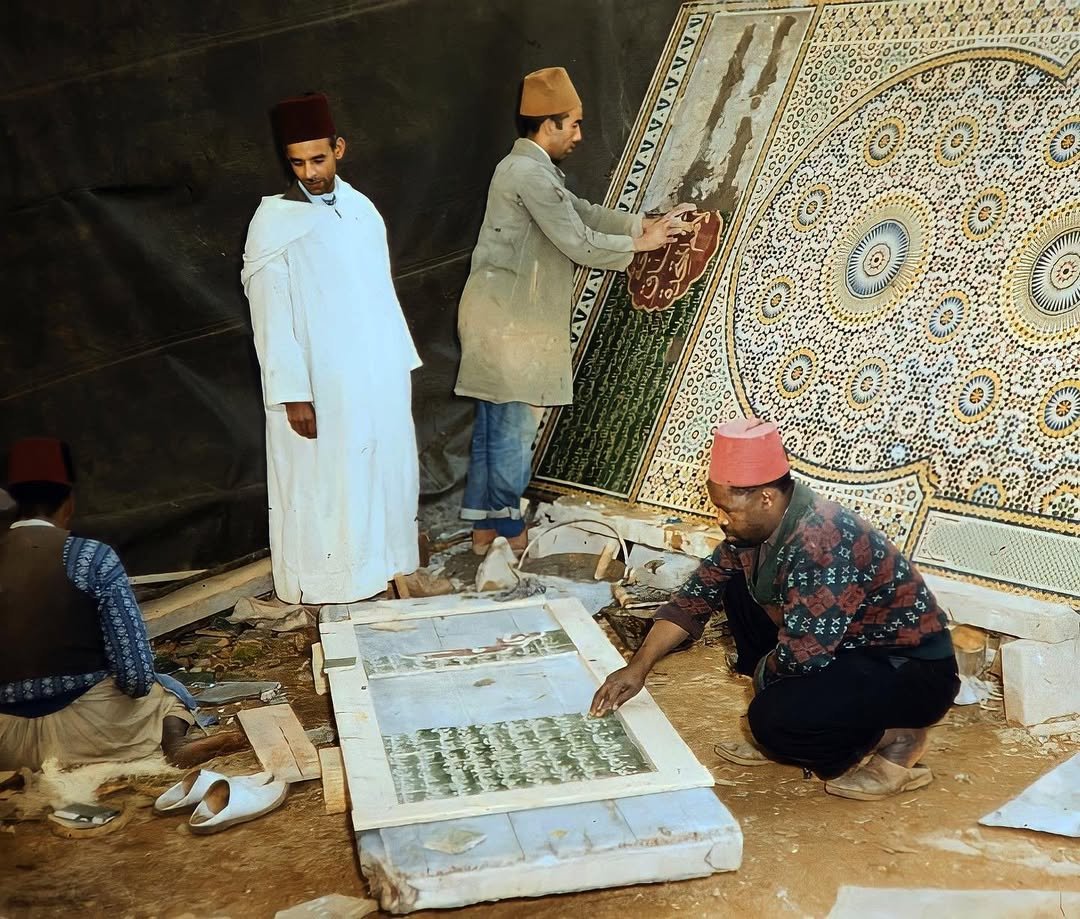 Moroccan zellige artisans at work cutting tiles by hand